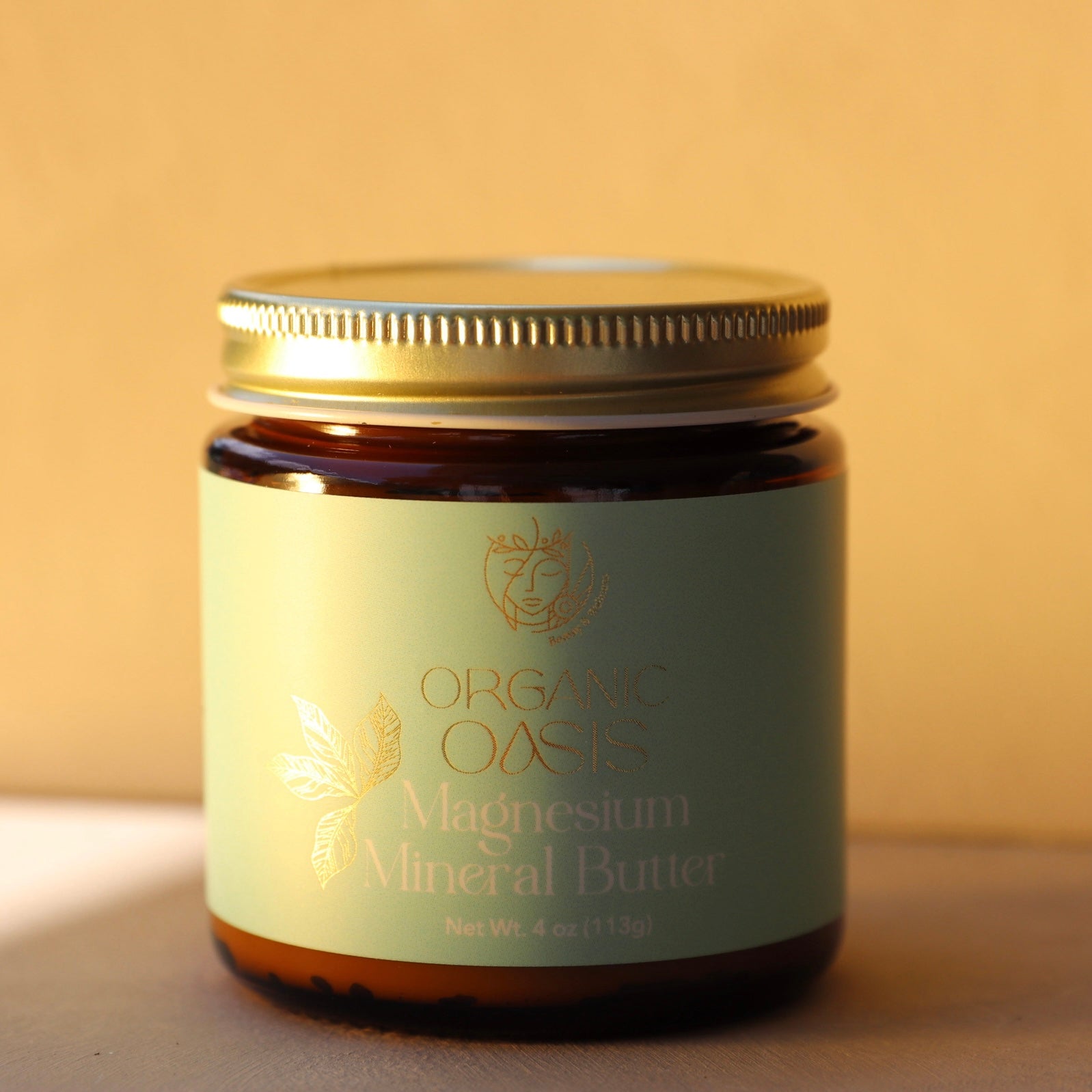 Jar of Organic Oasis Magnesium Mineral Butter on a beige background