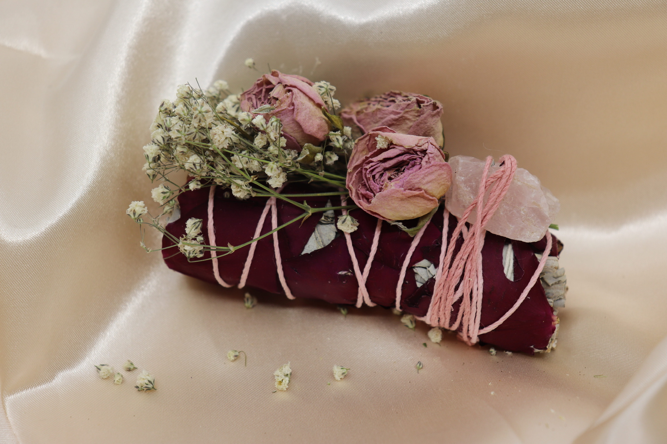 Decorative sage ritual bundle featuring dried botanicals