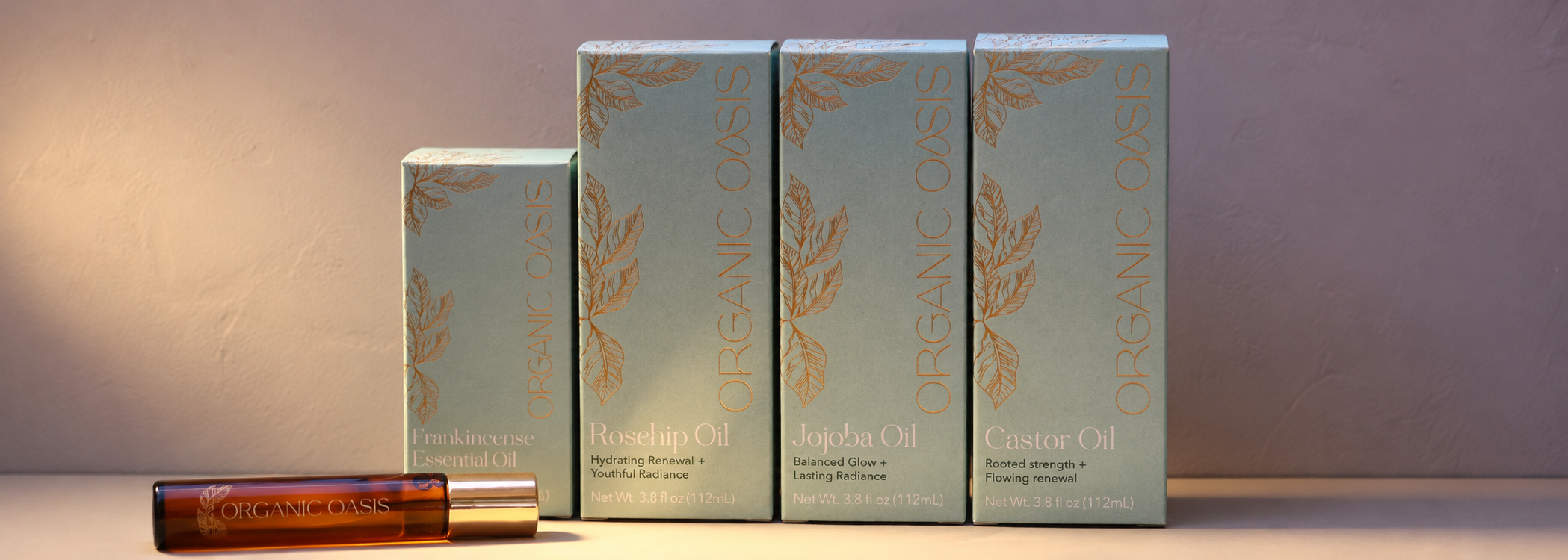 Four boxes of 'The Organic Shop' product on a neutral background