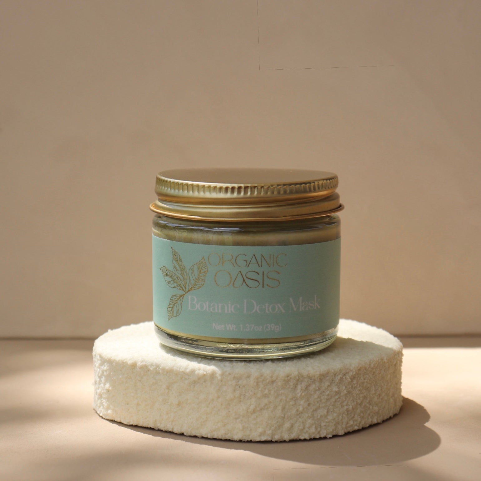 Organic matcha and French clay face mask in glass jar