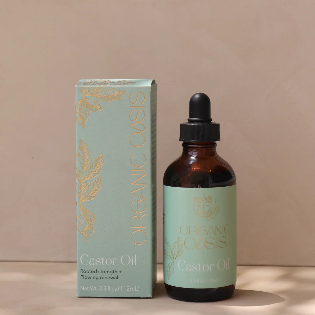 Organic Castor Root Oil bottle with product box by Organic Oasis