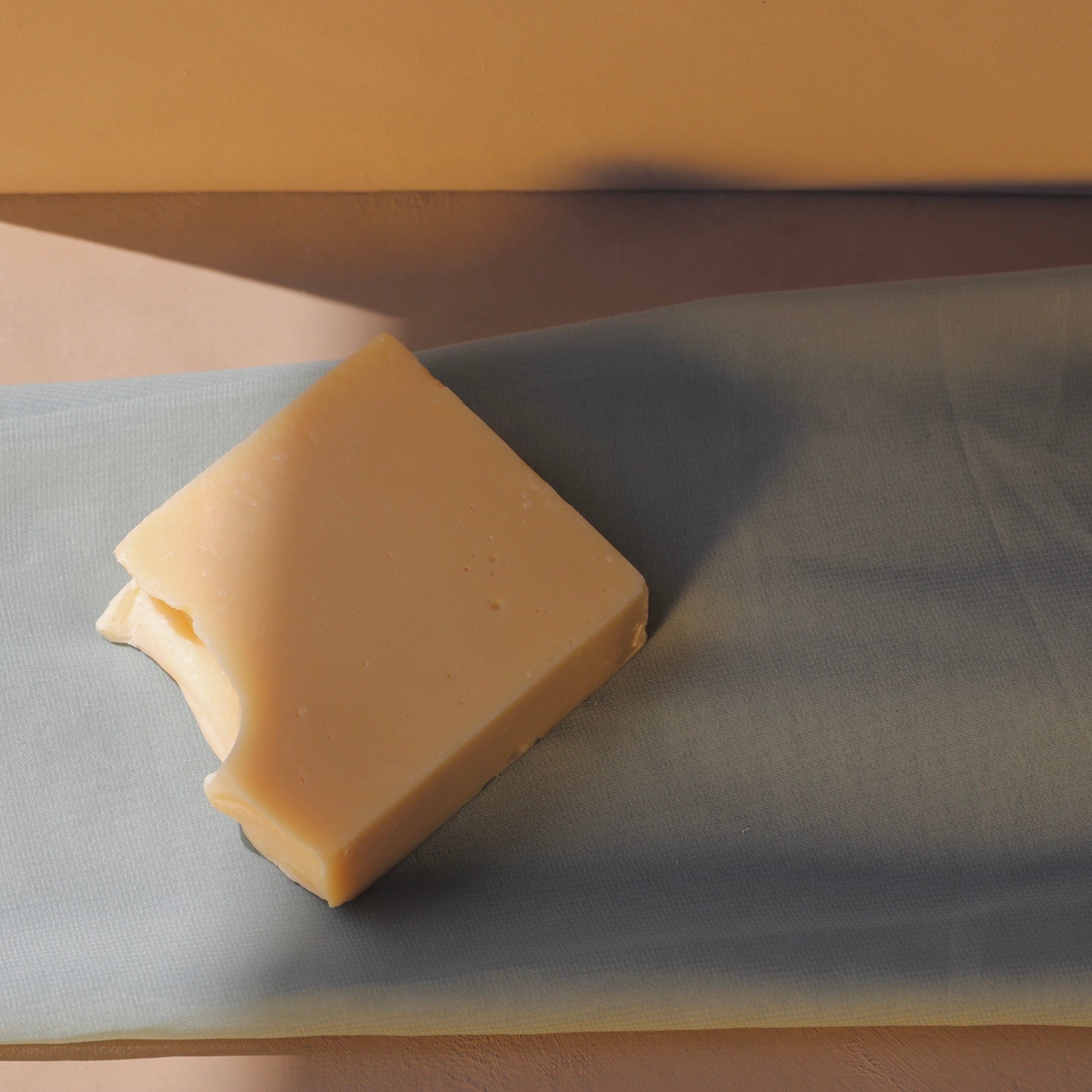 Simple Ritual tallow cleansing bar resting on folded fabric
