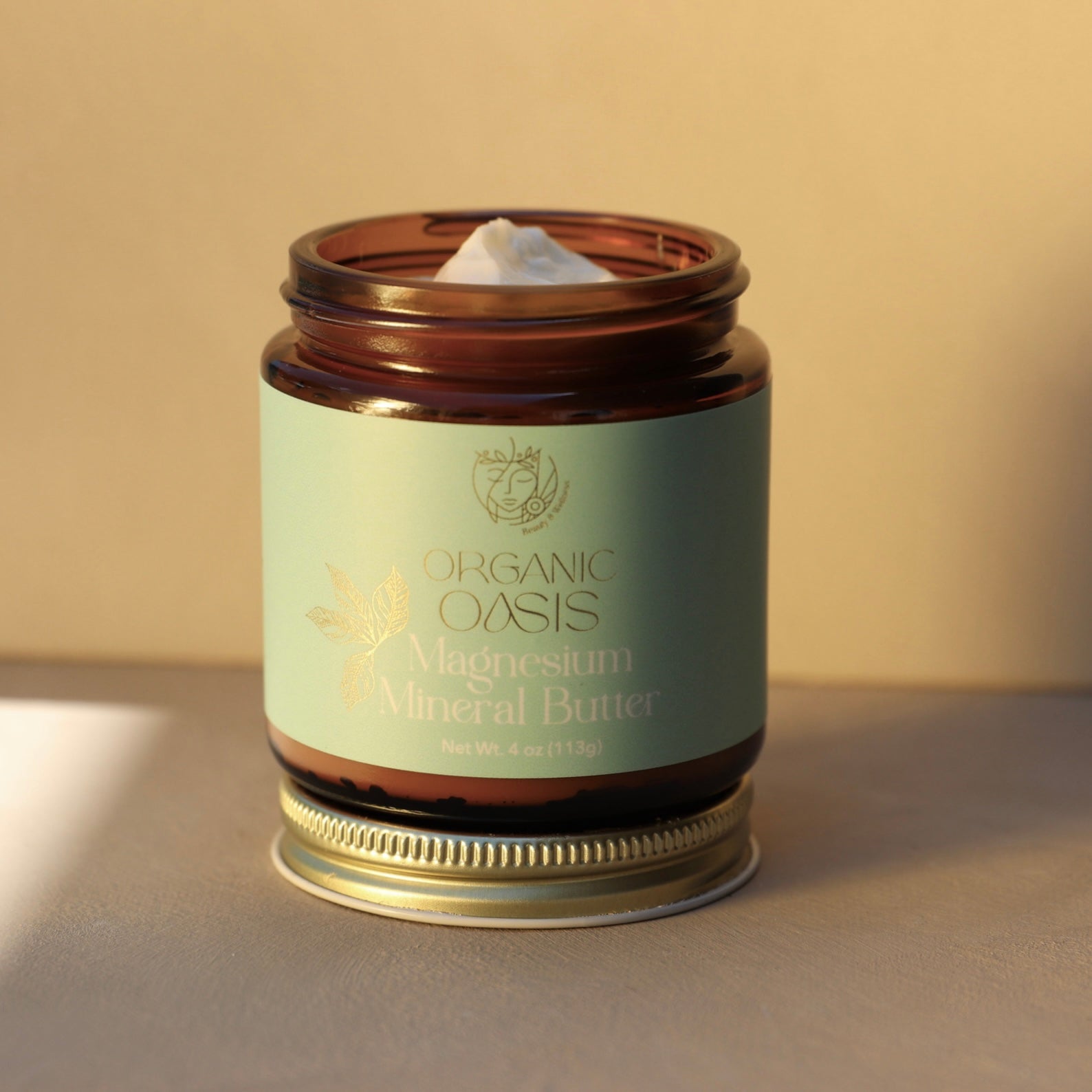Magnesium body butter in amber glass jar
