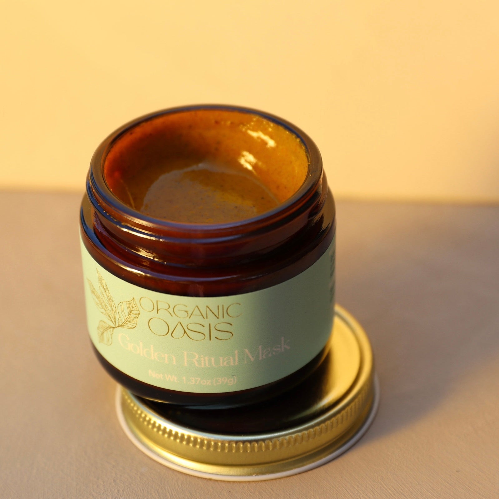 Open jar of turmeric face mask
