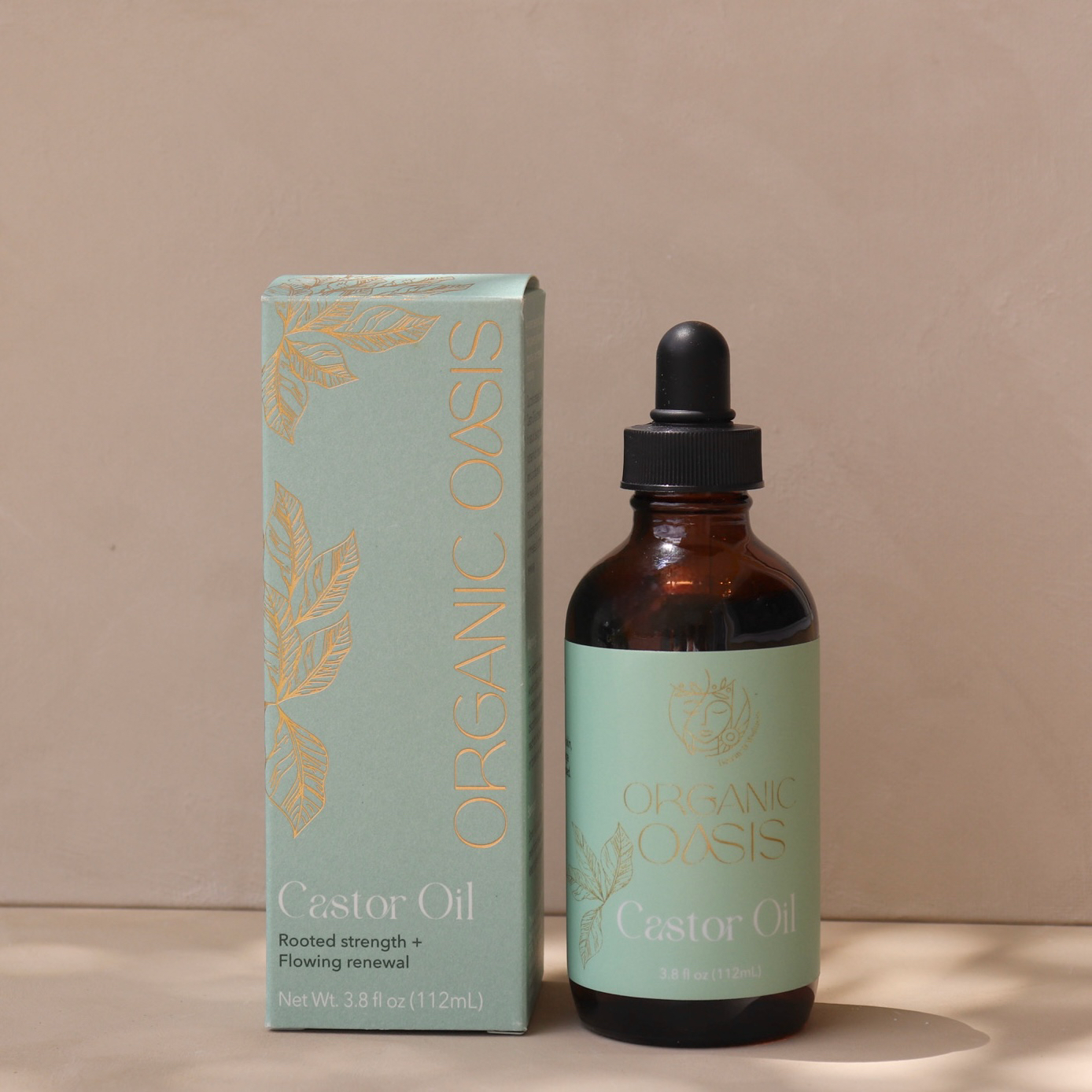 Organic Castor Root Oil bottle with product box by Organic Oasis