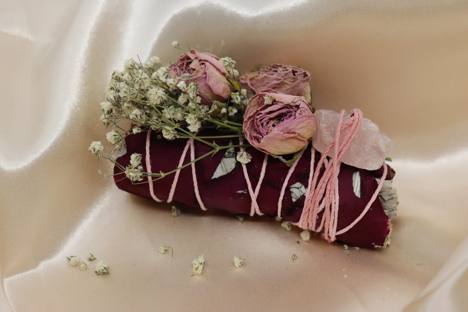 Decorative sage ritual bundle featuring dried botanicals
