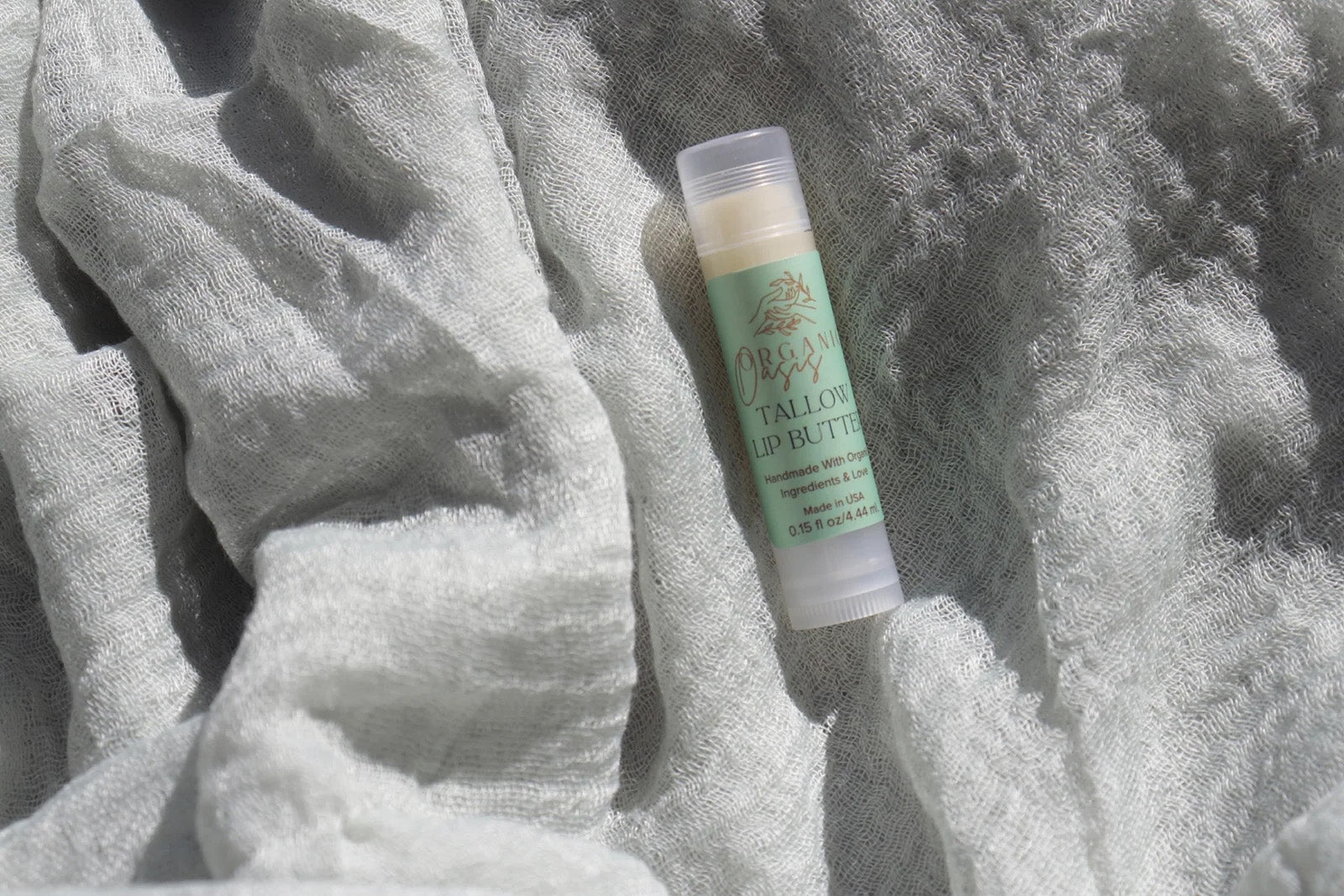 Grass-fed tallow lip butter in biodegradable tube
